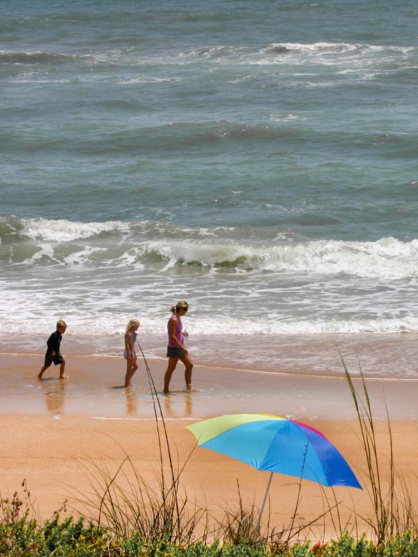 Family walking along Flagler Beach