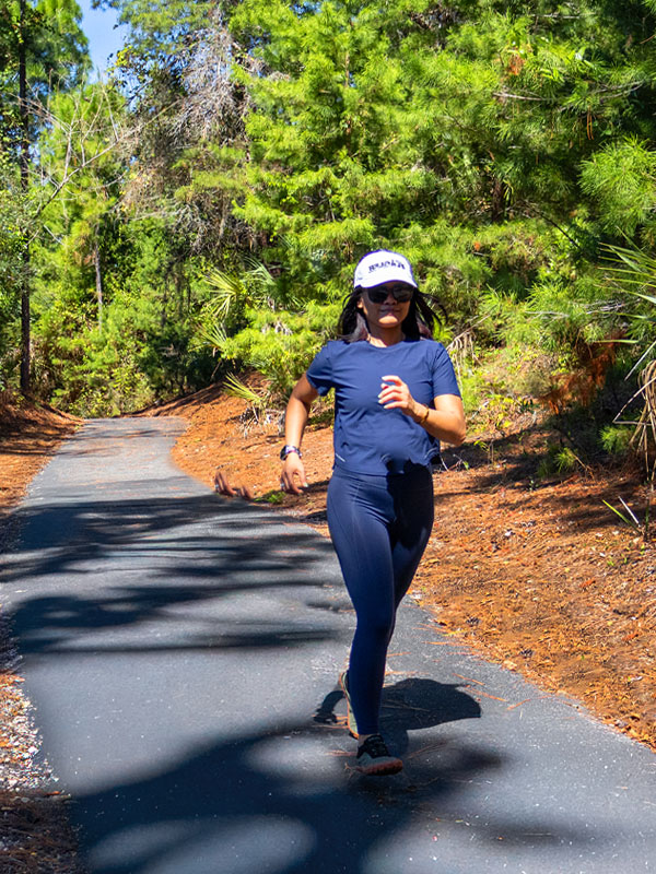 Woman running on walking / jogging trail