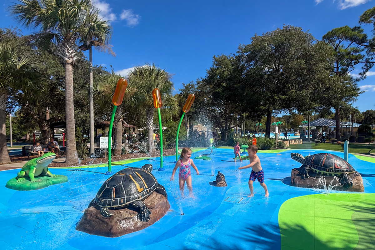 Children enjoying the splash pad at Holland Park, Palm Coast